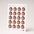 An A5 Everstory sheet standing upright, filled with twenty 1.25 inch face-cutout stickers of the same smiling toddler
