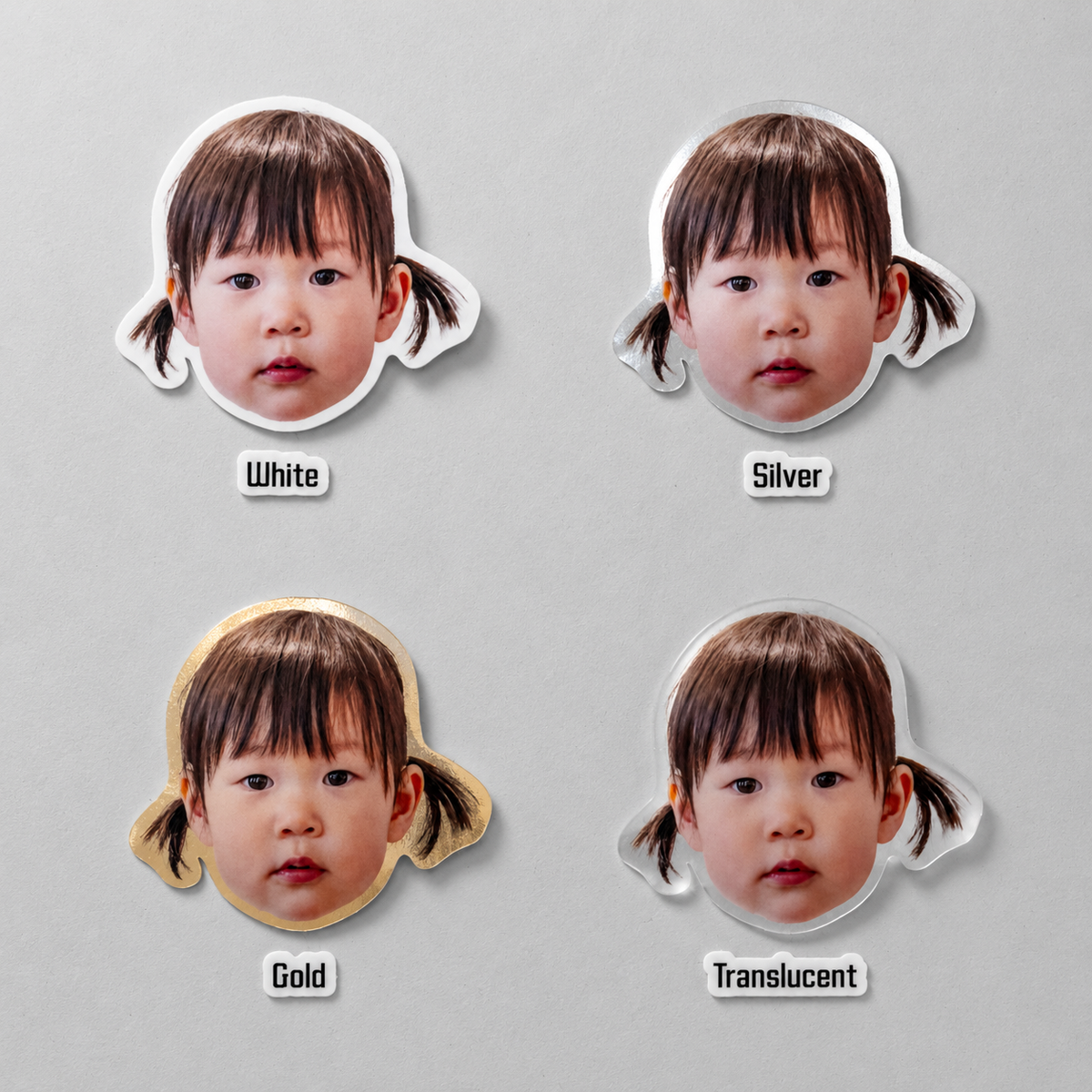 The same toddler face sticker shown in all four finishes side by side: white matte, silver, gold and translucent