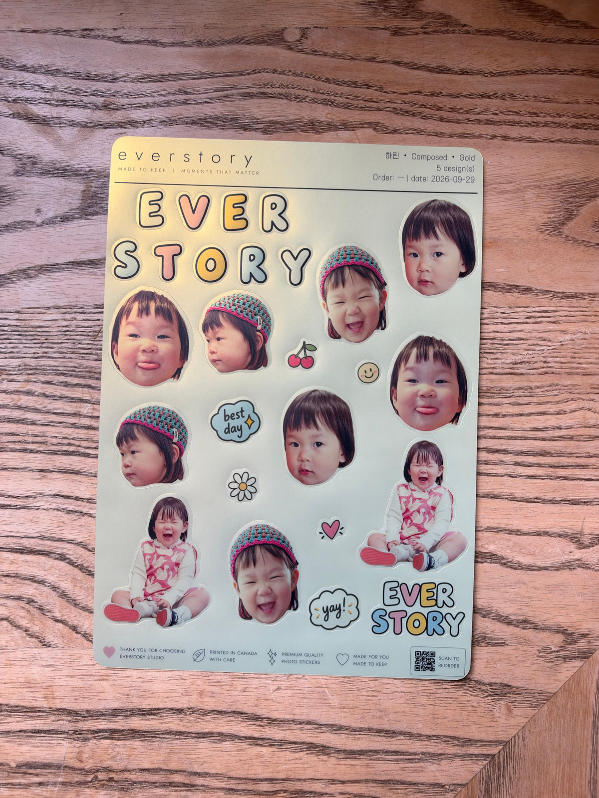 Gold sticker sheet photographed on wood