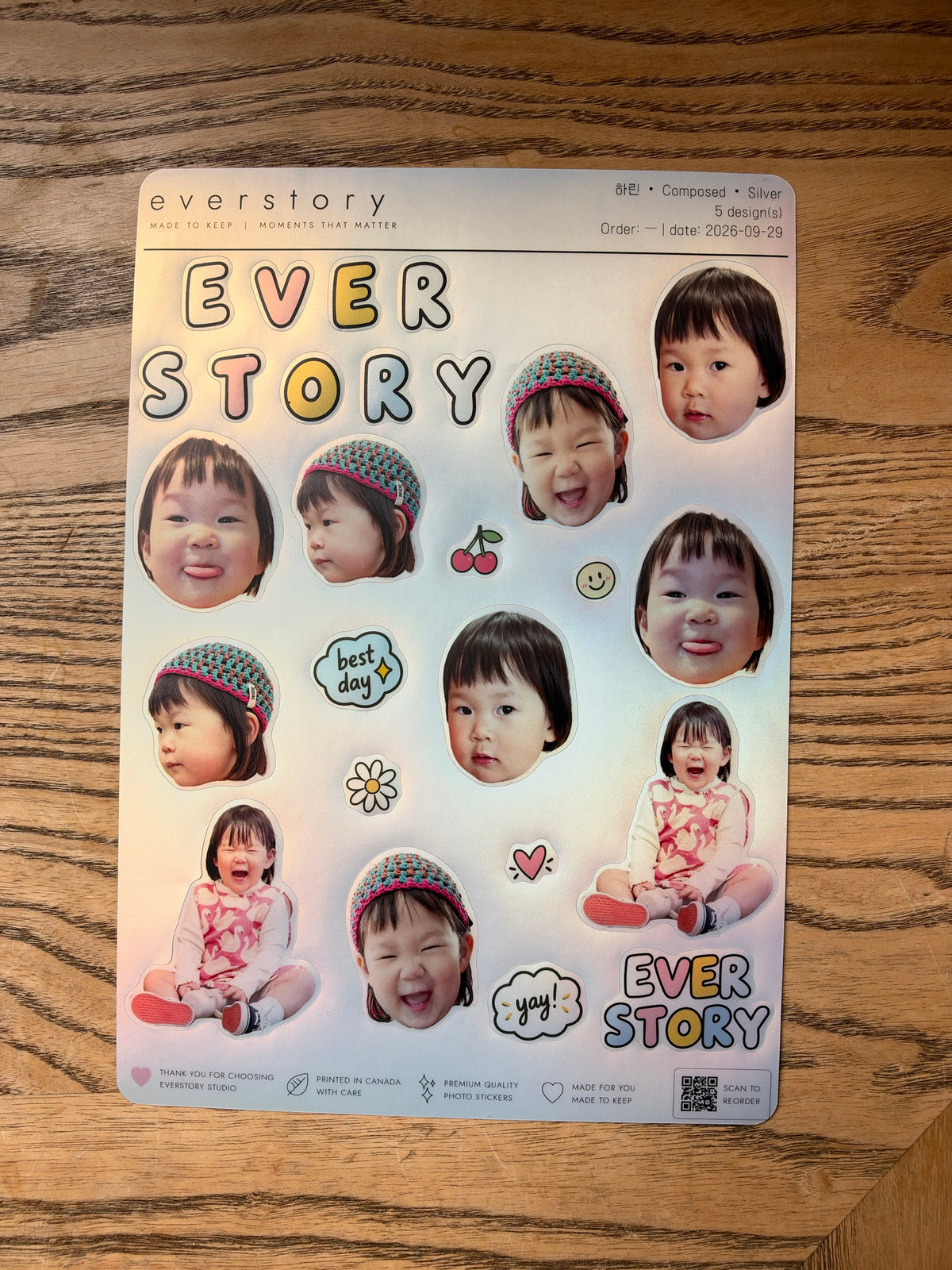 Silver sticker sheet photographed on wood